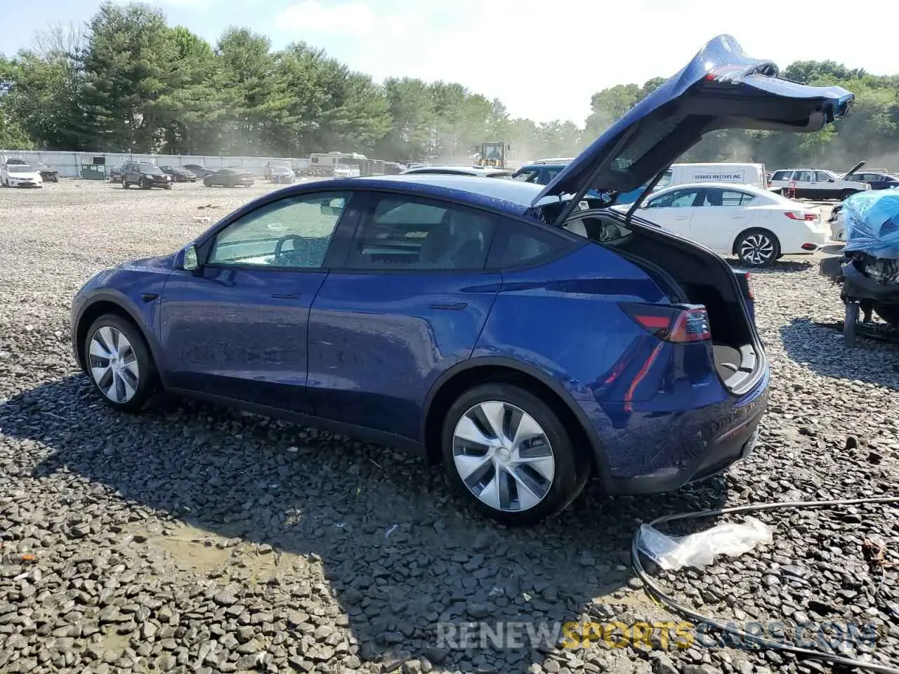 2 fotografías del automóvil dañado 7SAYGAEE9RF072132 TESLA MODEL Y 2024