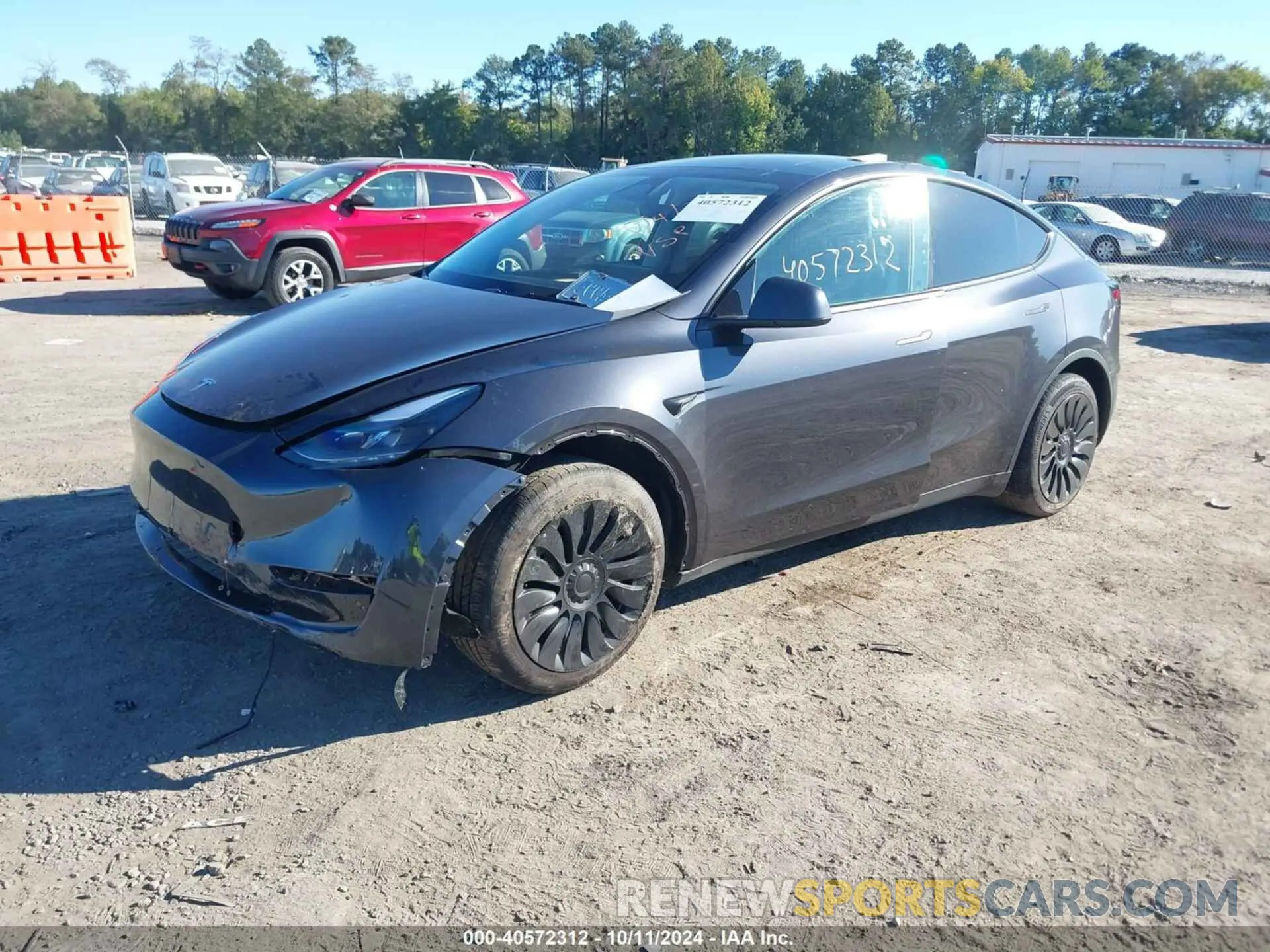 2 fotografías del automóvil dañado 7SAYGDED3RF092501 TESLA MODEL Y 2024