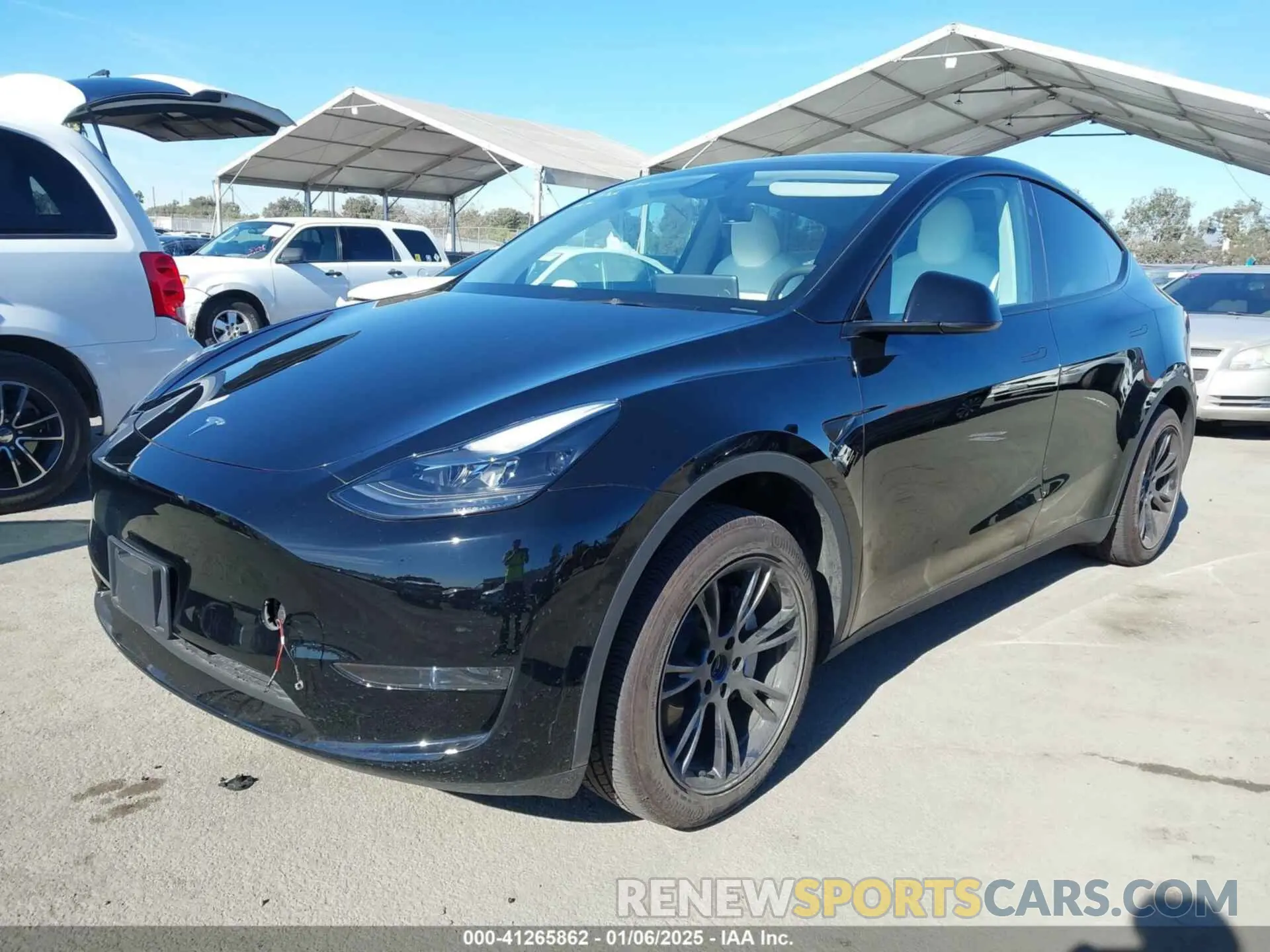 2 fotografías del automóvil dañado 7SAYGDED6RF152657 TESLA MODEL Y 2024