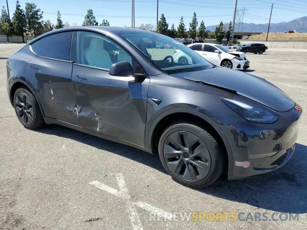 4 fotografías del automóvil dañado 7SAYGDED7RF199485 TESLA MODEL Y 2024