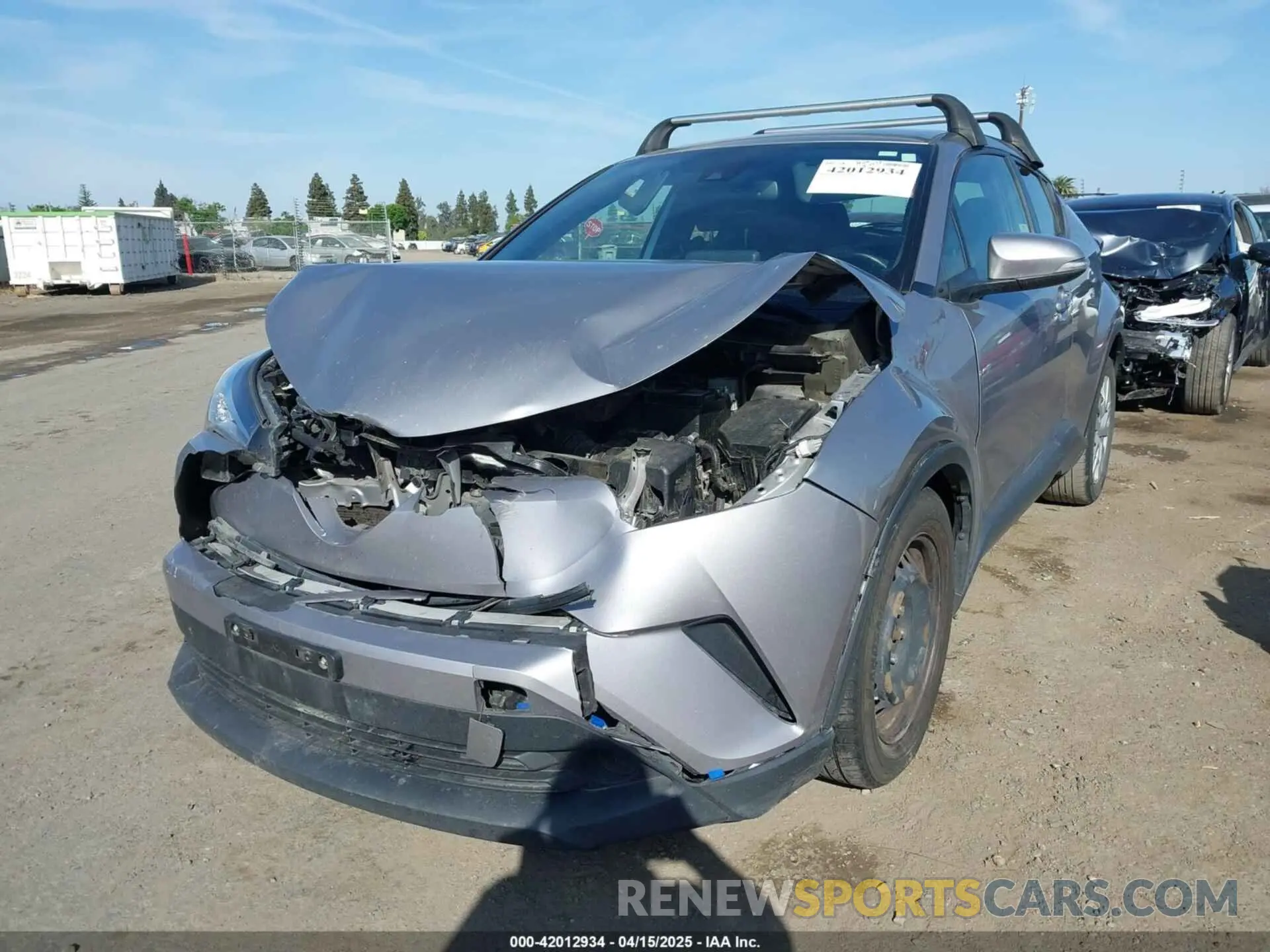 2 fotografías del automóvil dañado JTNKHMBX9K1044591 TOYOTA C-HR 2019