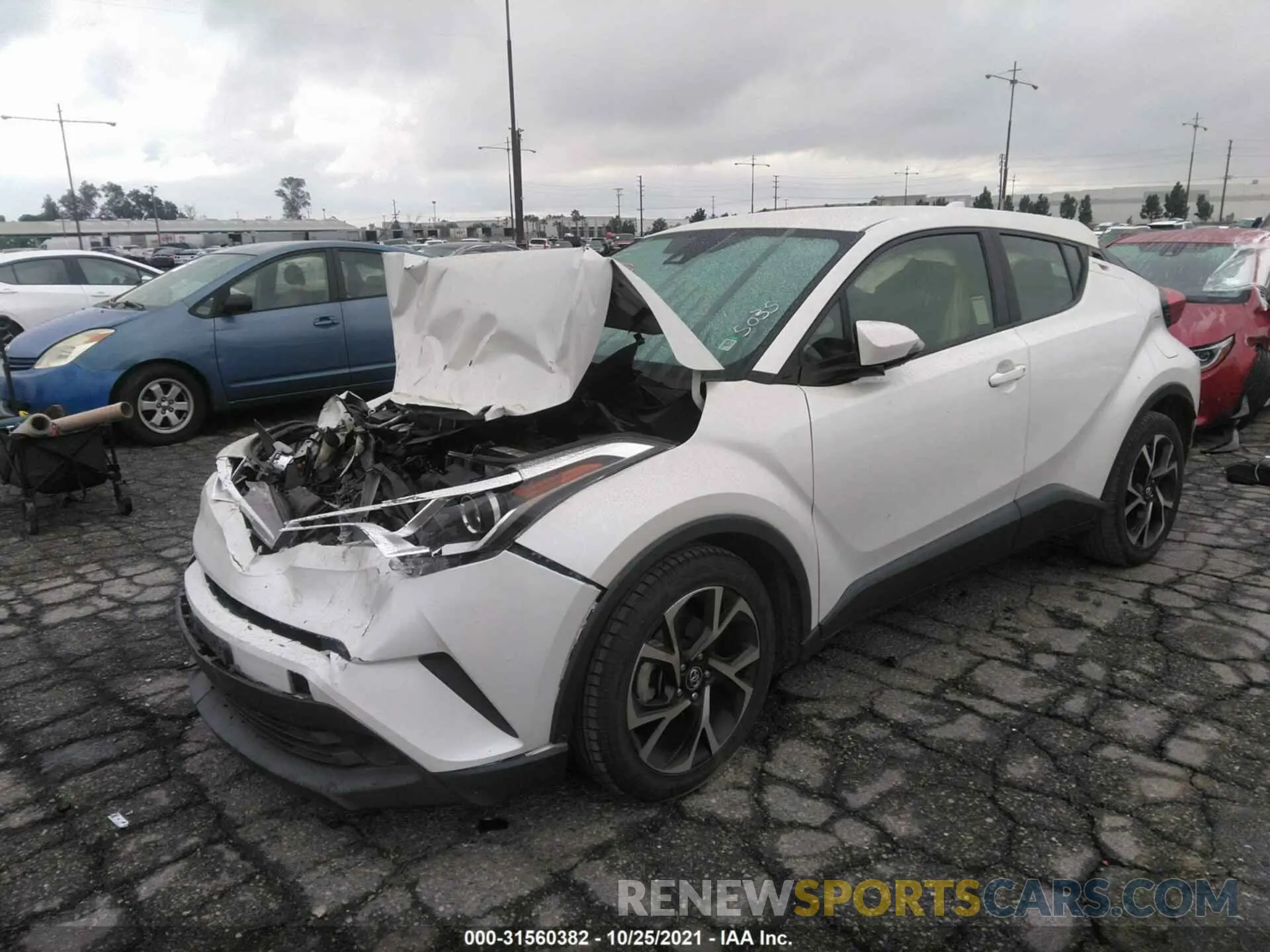 2 fotografías del automóvil dañado JTNKHMBXXK1015035 TOYOTA C-HR 2019