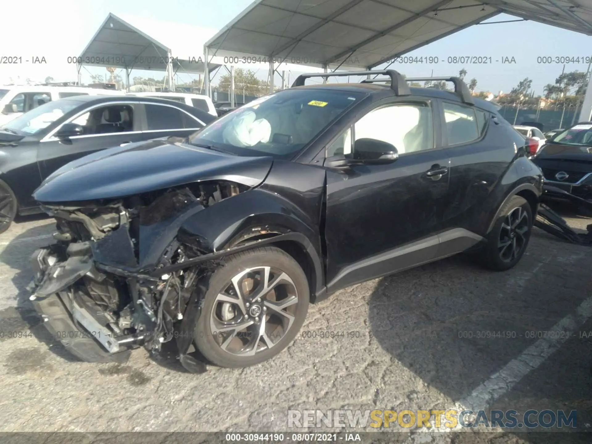 2 fotografías del automóvil dañado JTNKHMBXXK1035964 TOYOTA C-HR 2019