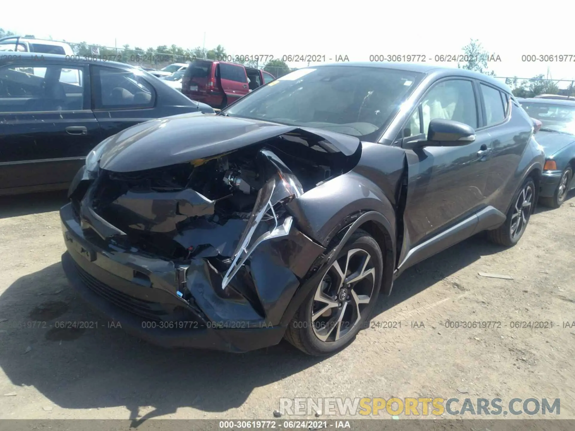 2 fotografías del automóvil dañado JTNKHMBXXK1053509 TOYOTA C-HR 2019