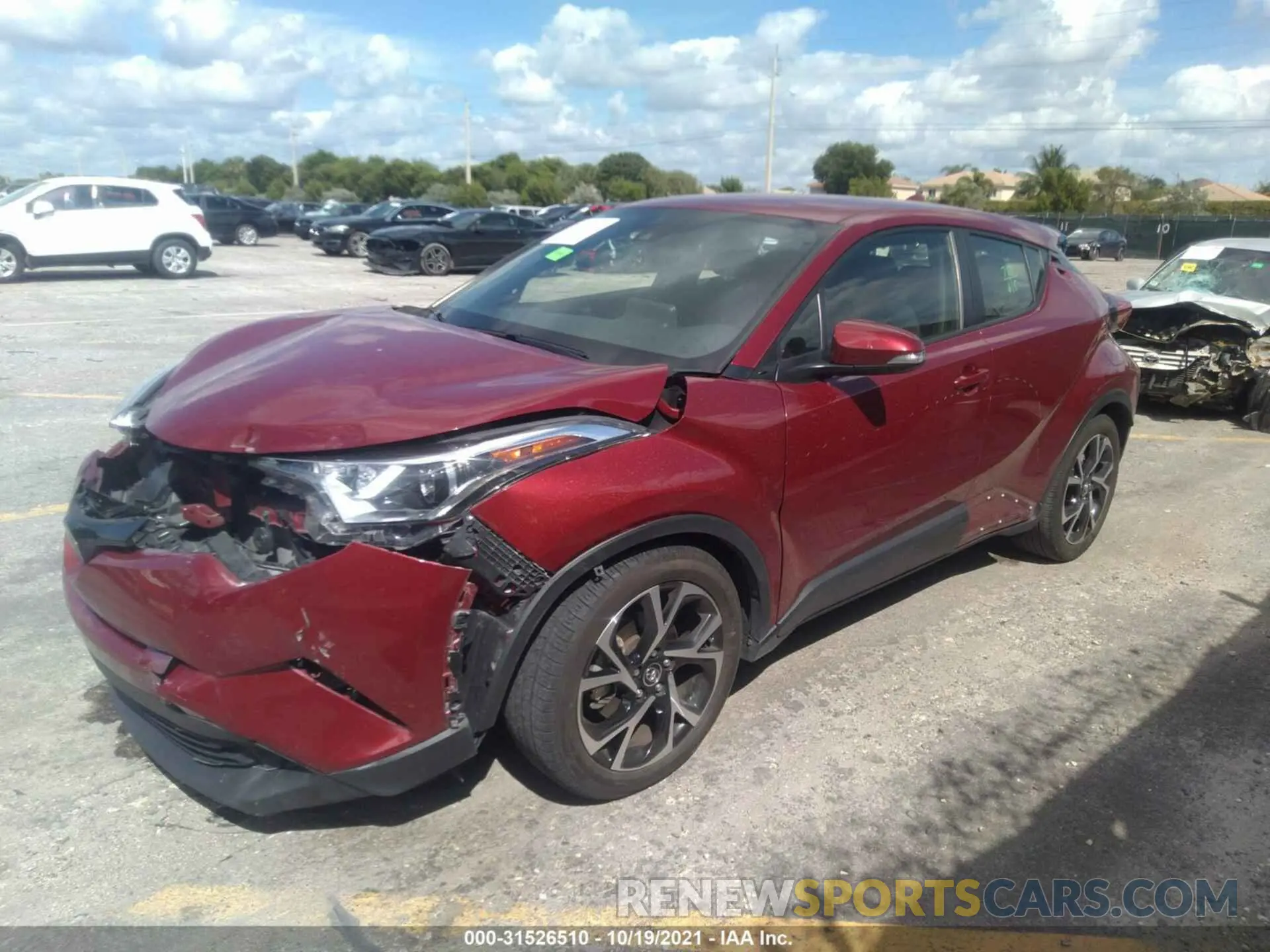 2 fotografías del automóvil dañado JTNKHMBXXK1054143 TOYOTA C-HR 2019