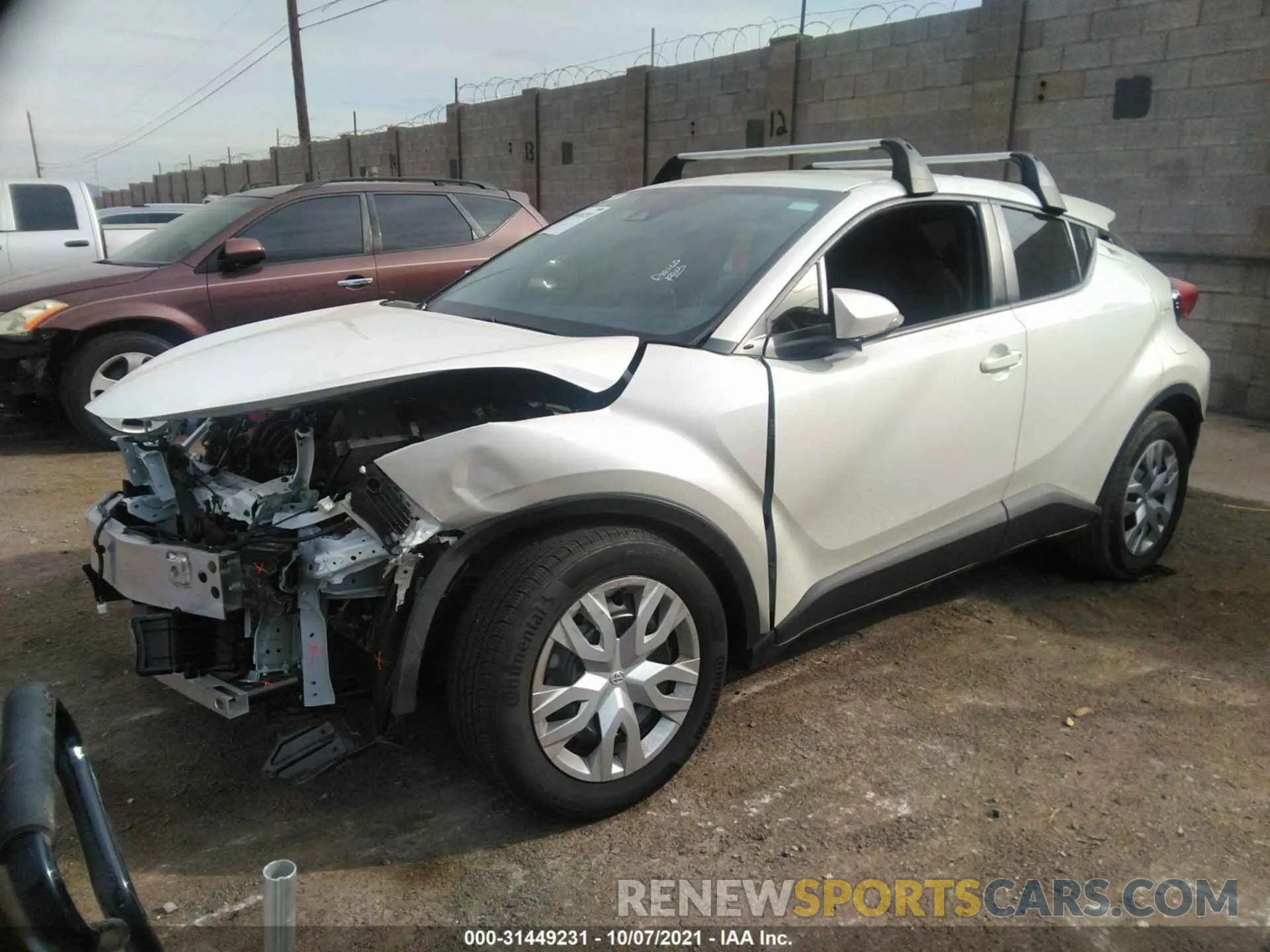 2 fotografías del automóvil dañado JTNKHMBX6M1120335 TOYOTA C-HR 2021