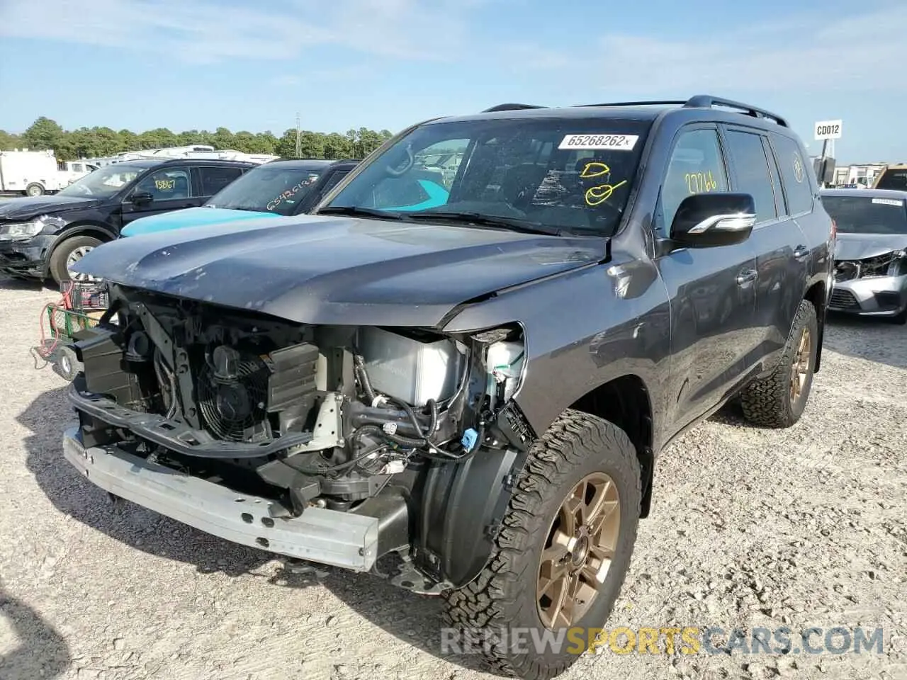 2 fotografías del automóvil dañado JTMCY7AJ2M4105532 TOYOTA LAND CRUIS 2021
