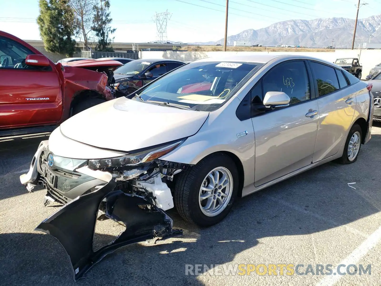 2 fotografías del automóvil dañado JTDKAMFPXM3170890 TOYOTA PRIUS 2021