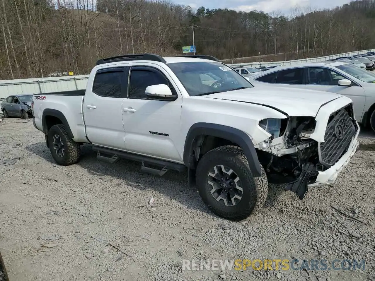 4 fotografías del automóvil dañado 3TMDZ5BN4MM112574 TOYOTA TACOMA 2021