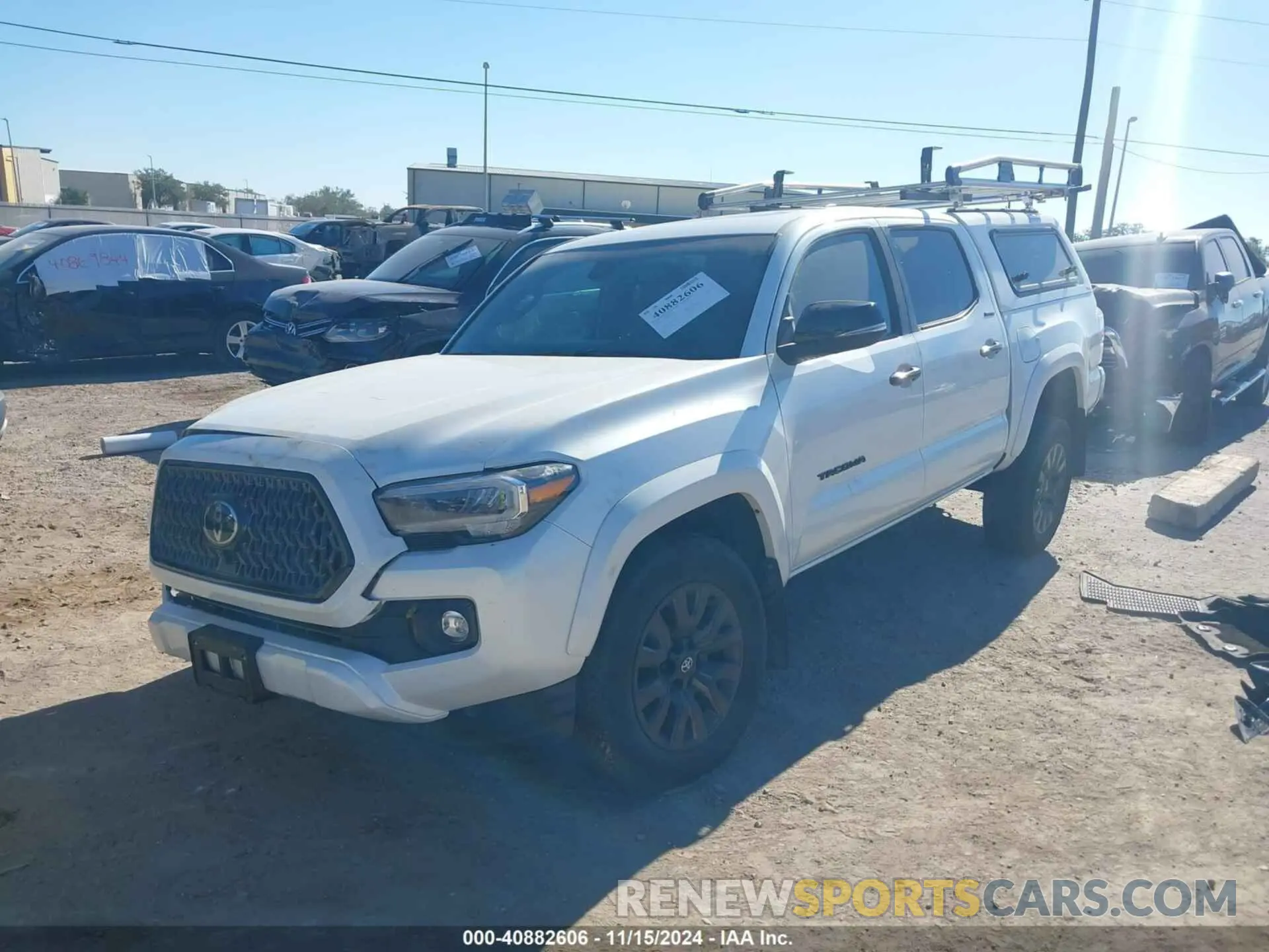 2 fotografías del automóvil dañado 3TYGZ5AN8MT027112 TOYOTA TACOMA 2021