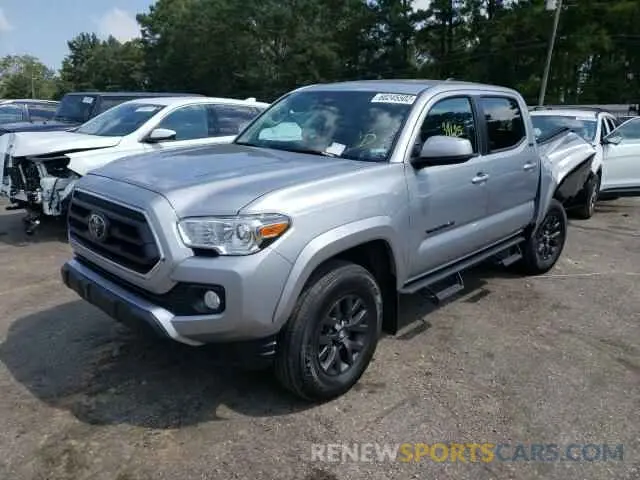 2 fotografías del automóvil dañado 5TFAZ5CN8MX114419 TOYOTA TACOMA 2021