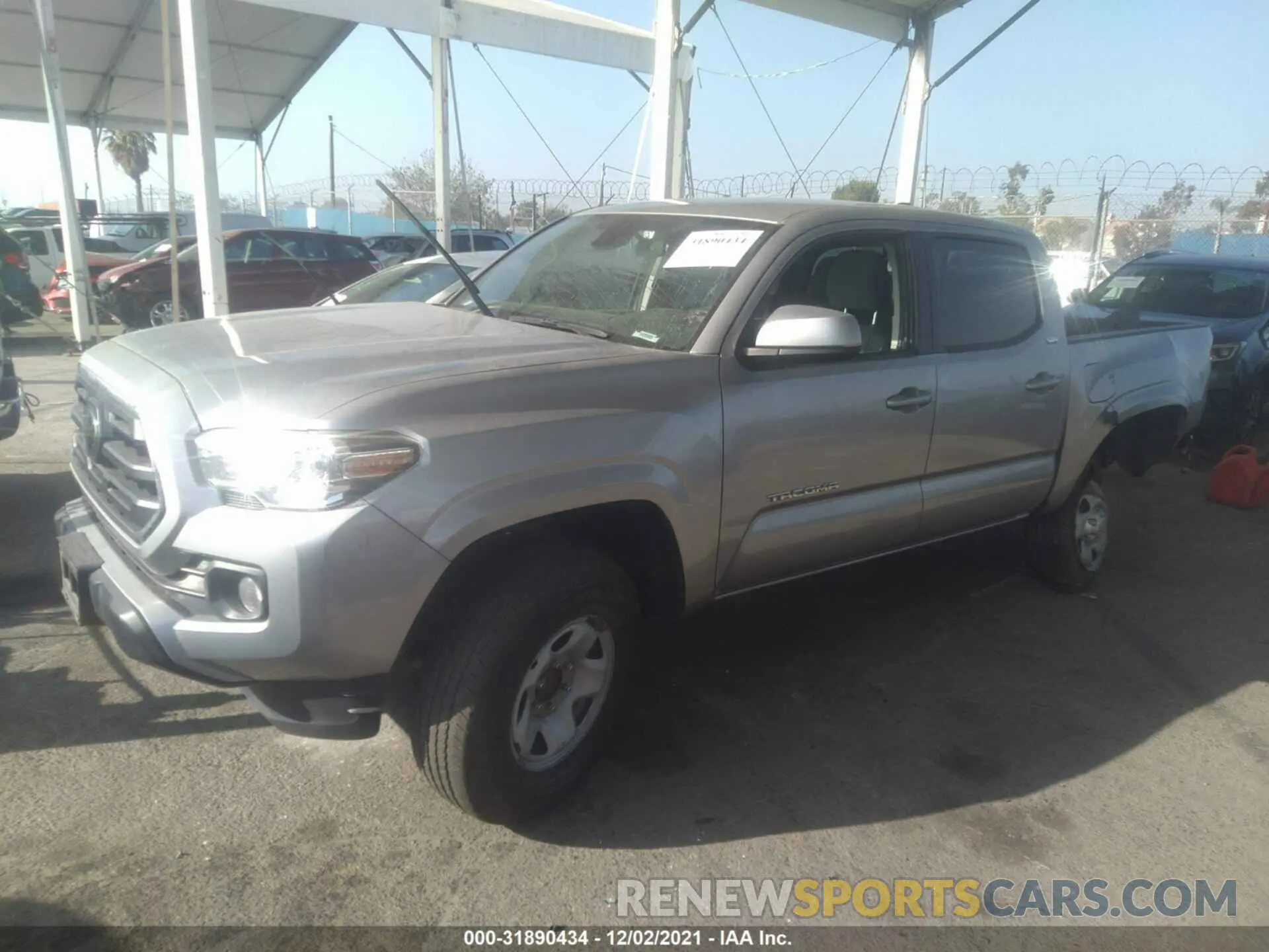 2 fotografías del automóvil dañado 5TFAX5GN0KX132393 TOYOTA TACOMA 2WD 2019